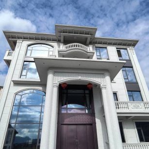 大连白麻别墅外墙干挂石材效果示例