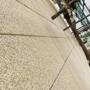 大连 黄金麻花岗岩荔枝面外墙干挂石材效果示例