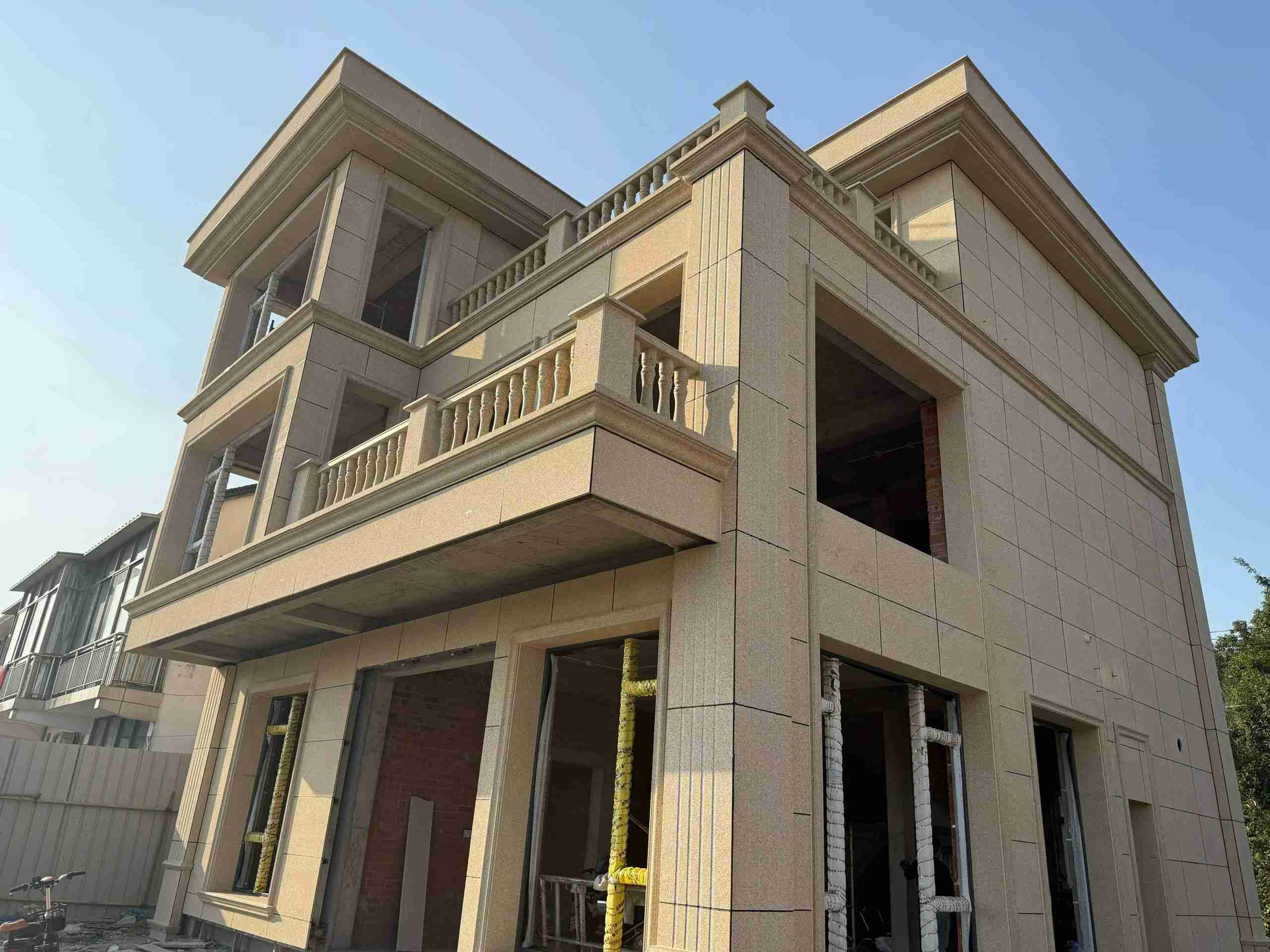 大连 黄金麻花岗岩石材荔枝面外墙干挂效果展示